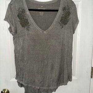 American eagle top with green detailing in size medium